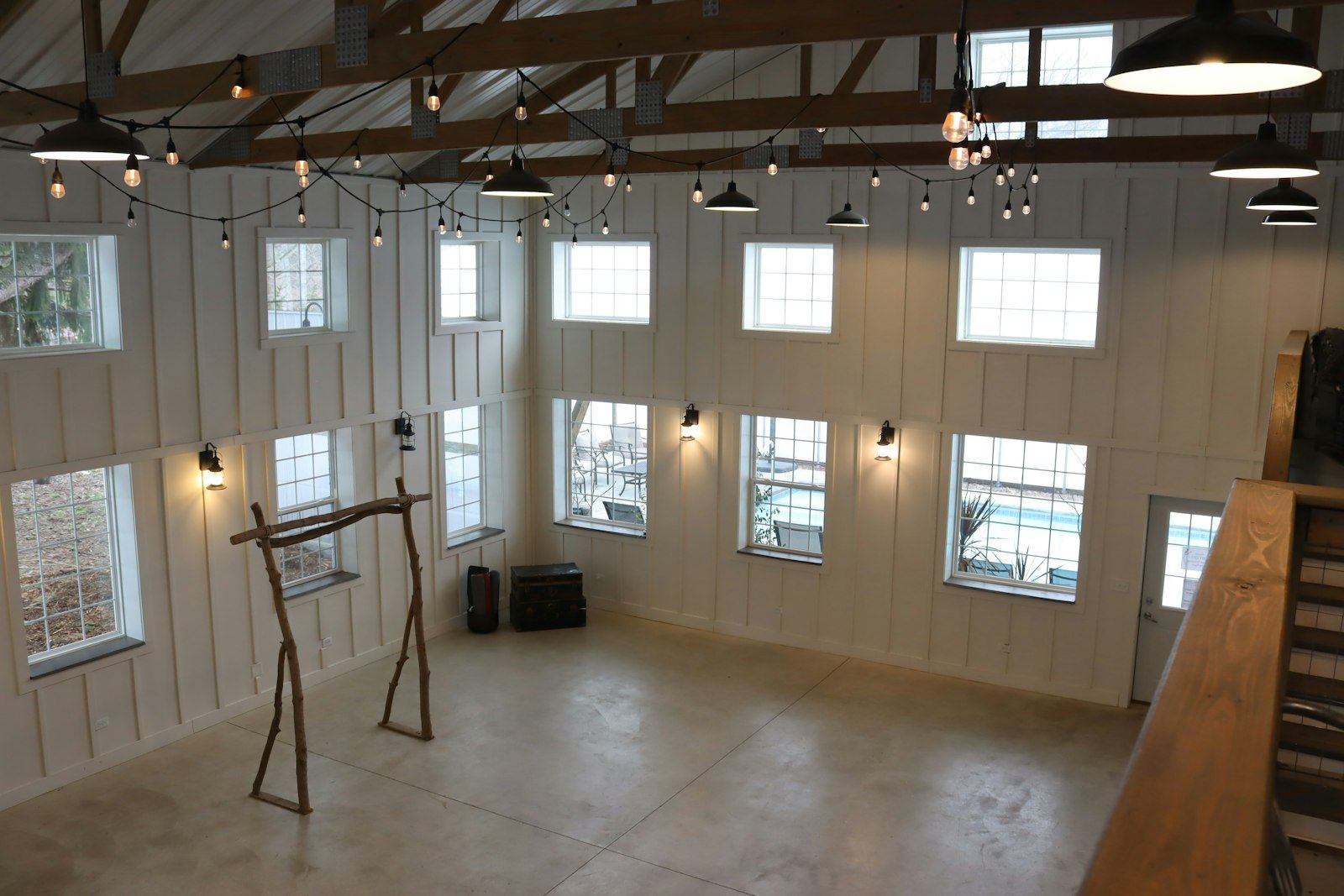Open plan living space inside a converted barn with exposed beams