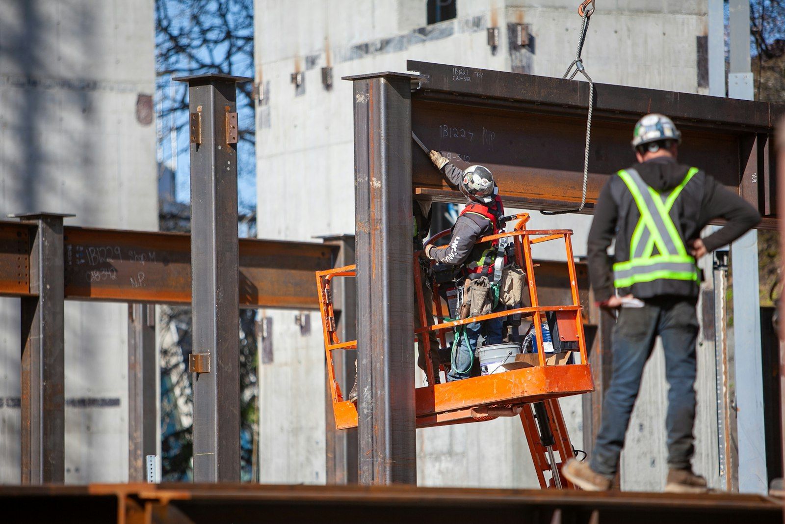 New steel beam being fitted into the existing structure of an old building