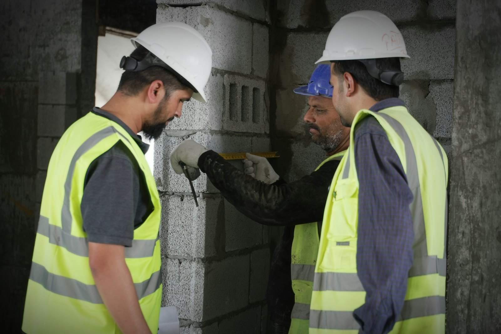 Warranty surveyor inspecting the structure of a building on site